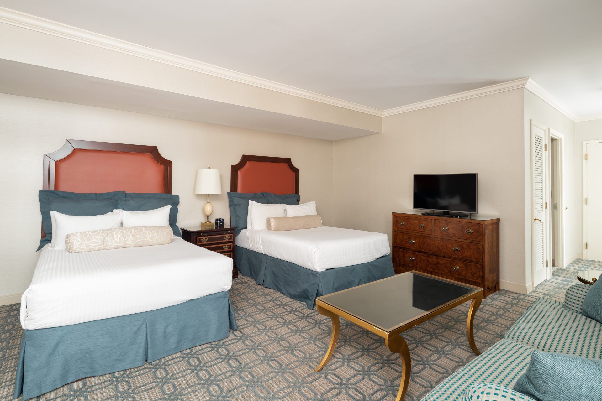 Terrace room sleeping area with two full beds at The Berkeley Hotel