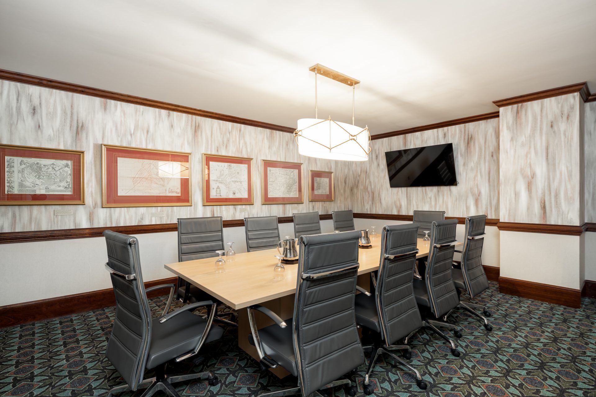Meeting space at The Berkeley Hotel with conference table and office chairs