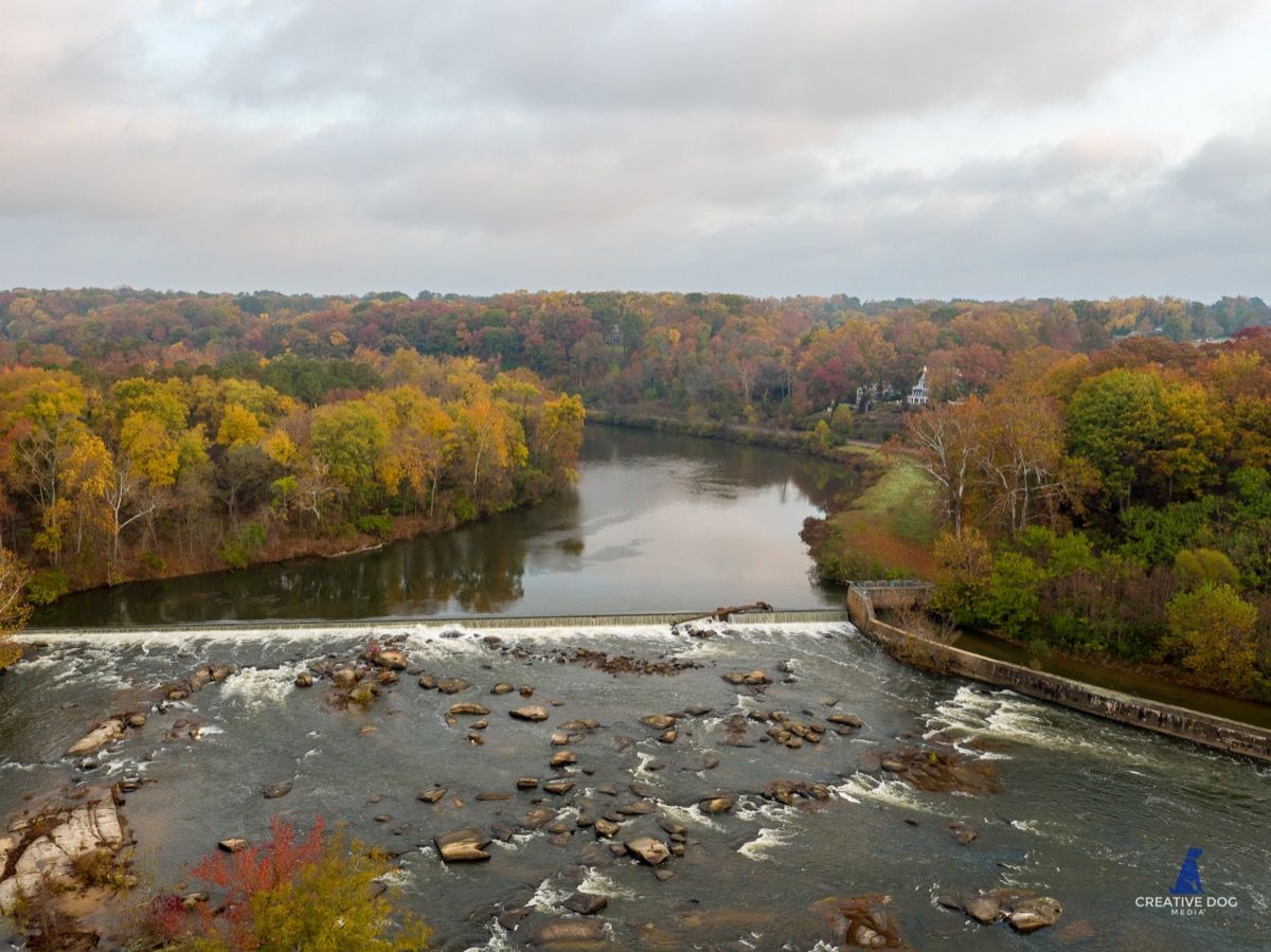 River in richmond, virginia surrounded by trees with fall leaves 