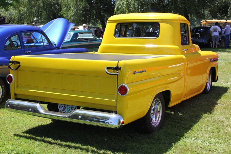 A yellow truck with a license plate that says ' sdmc ' on it