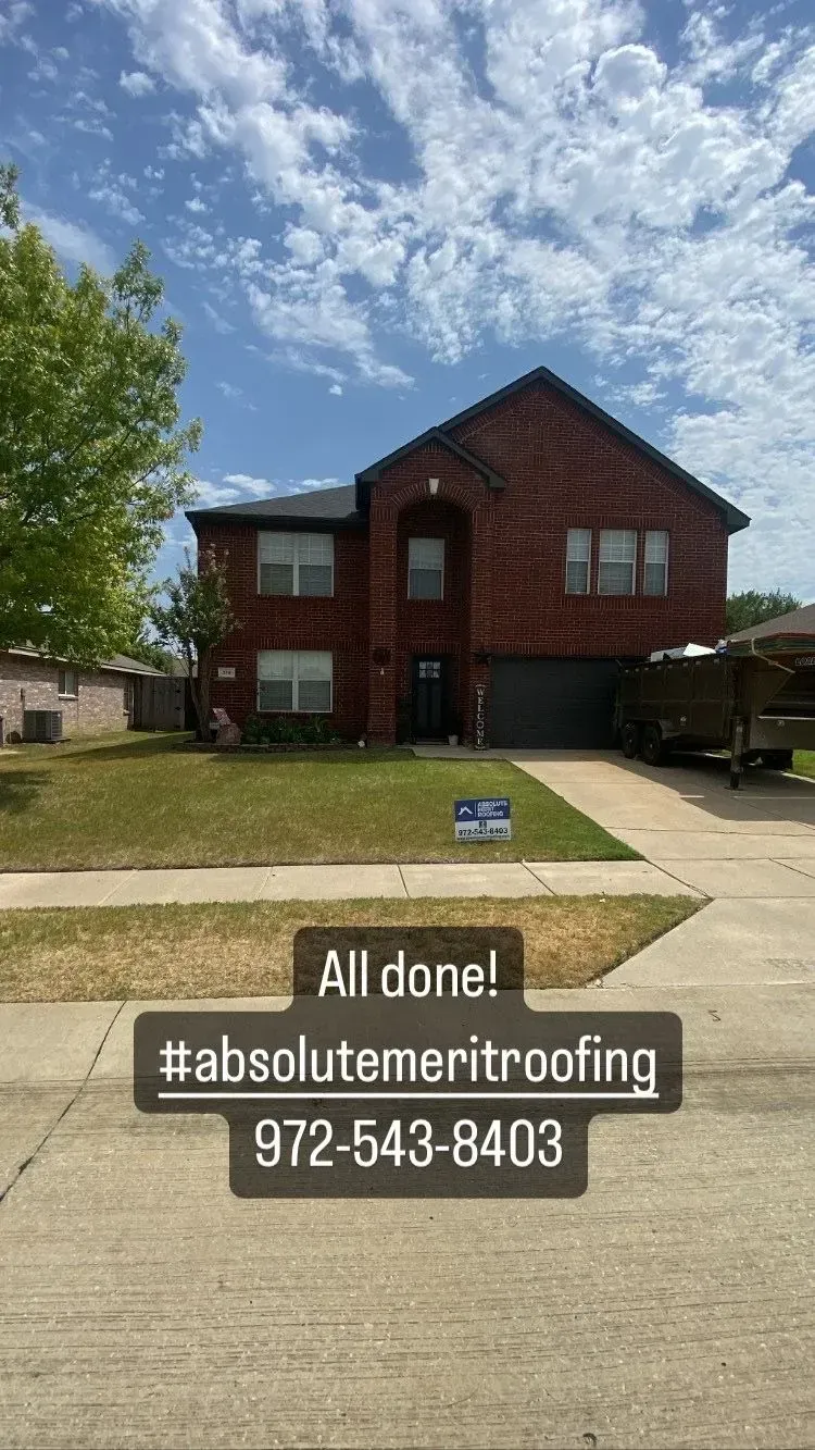 A large brick house is sitting on top of a lush green lawn.