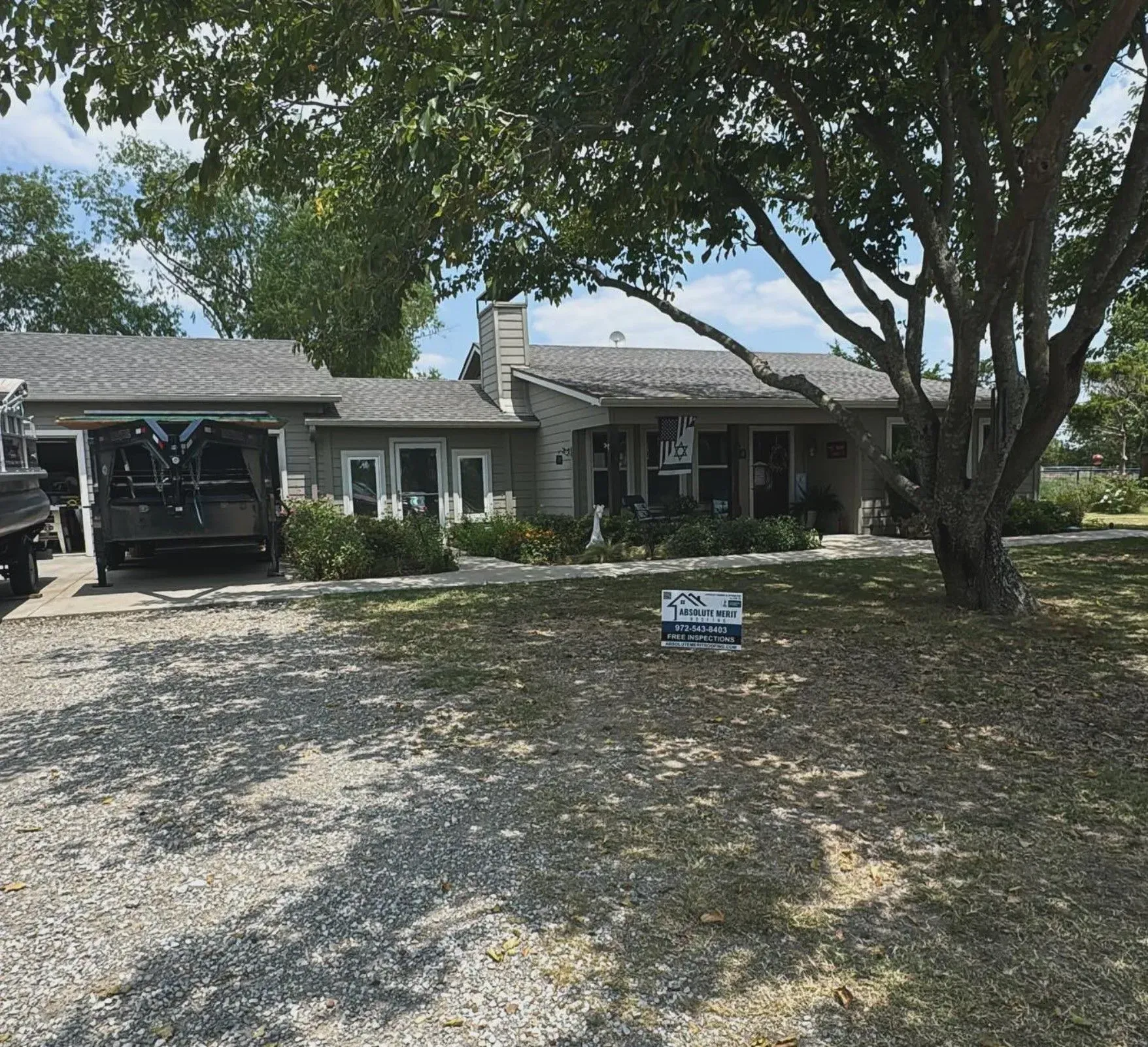 A house with a for sale sign in front of it