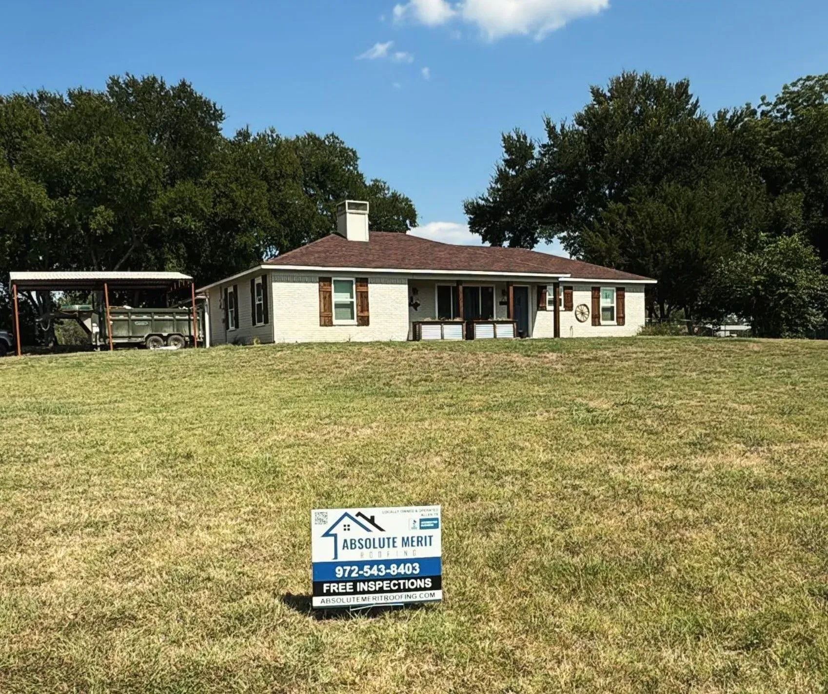 A house with a for sale sign in front of it