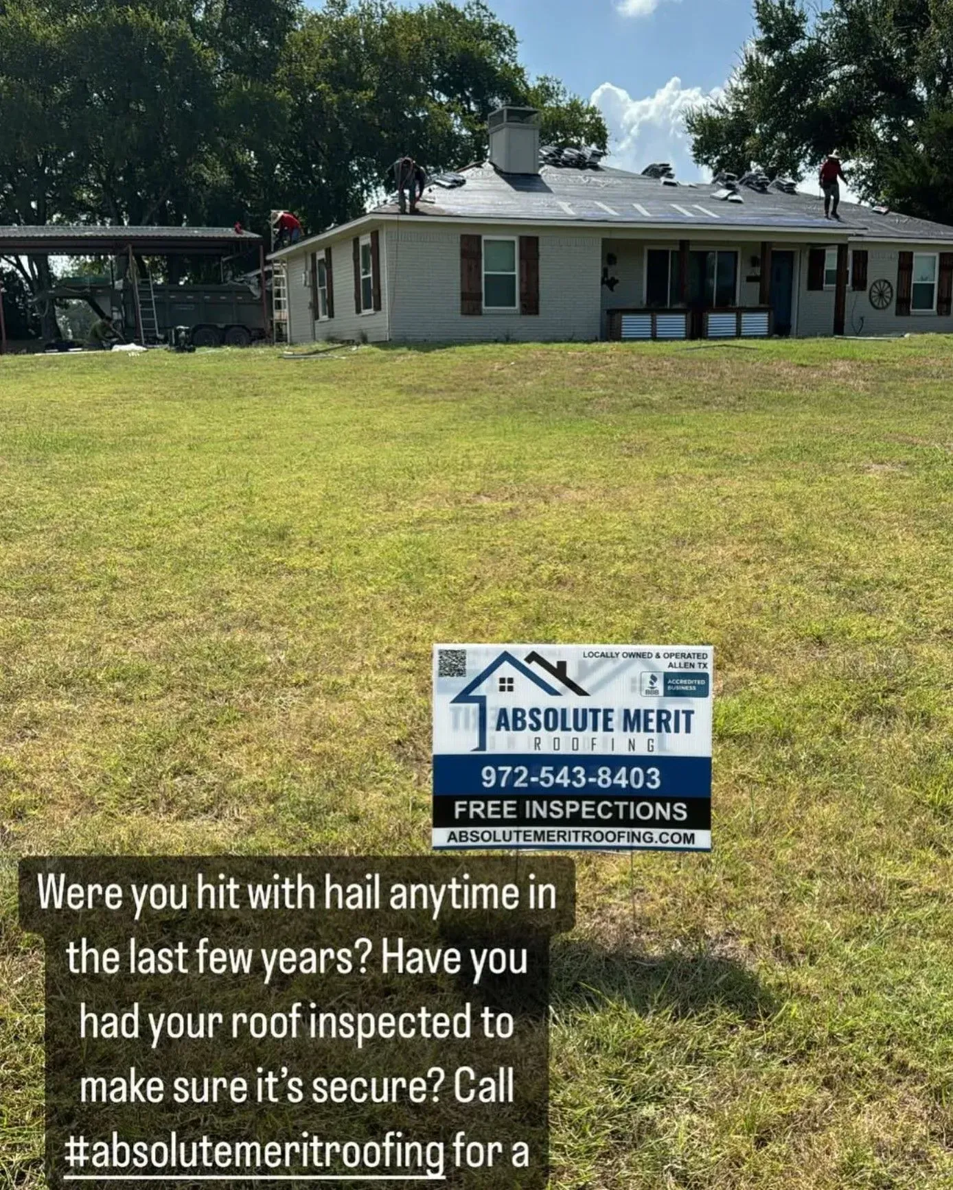 A house with a sign in front of it that says `` absolute merit roofing ''.