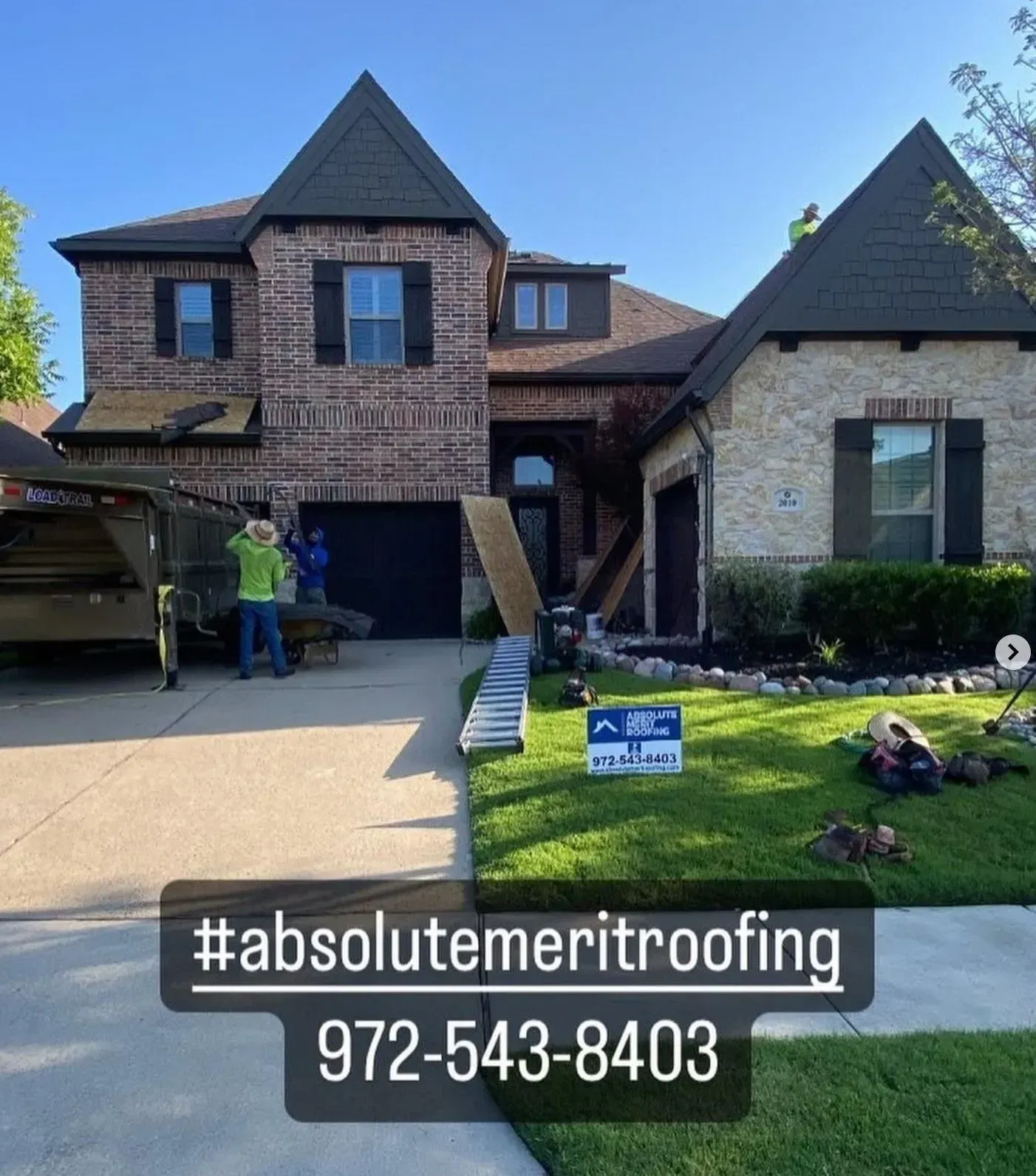 A house with a sign in front of it that says absolute meritroofing