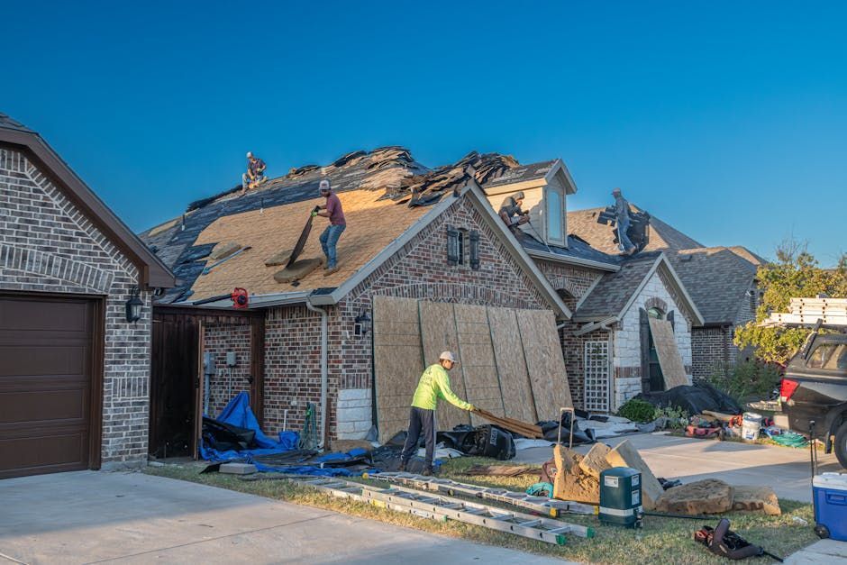 A group of people are working on a roof.