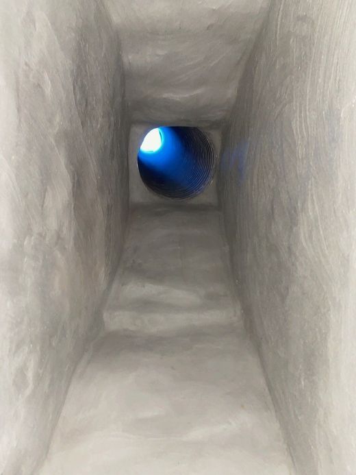 There is a light coming out of the hole in the smoke chamber.