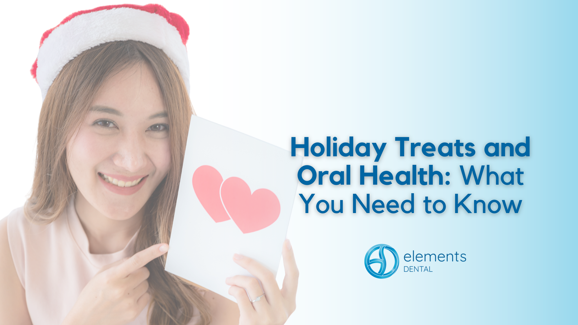 Woman in Santa hat points to card with hearts, text