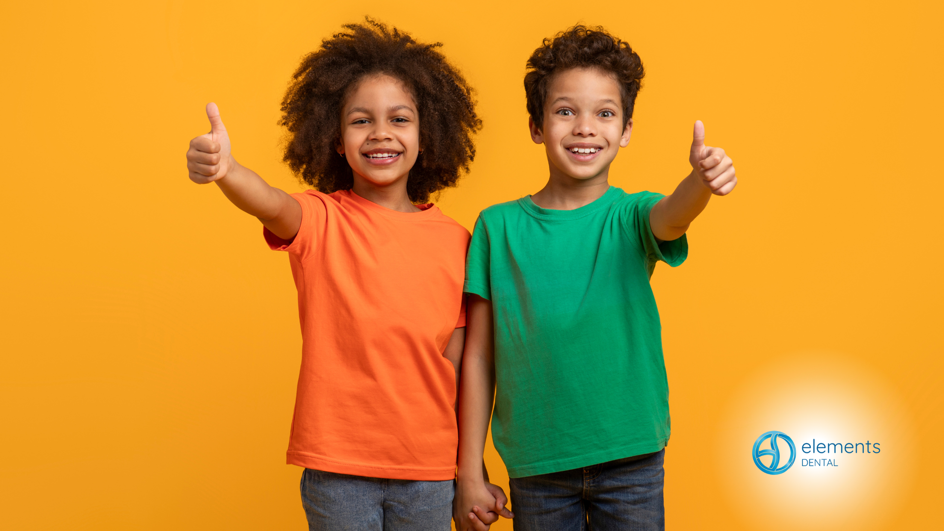 Two children smiling and giving thumbs up against a yellow background.