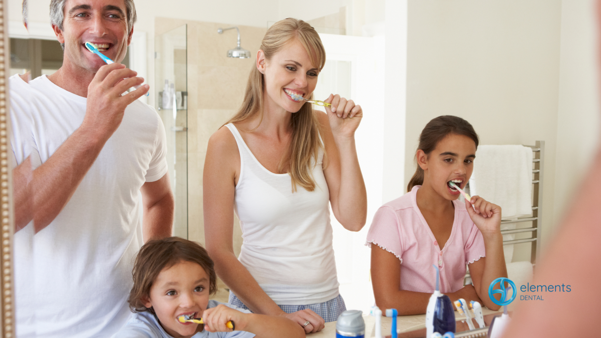 A family is brushing their teeth together in a bathroom.