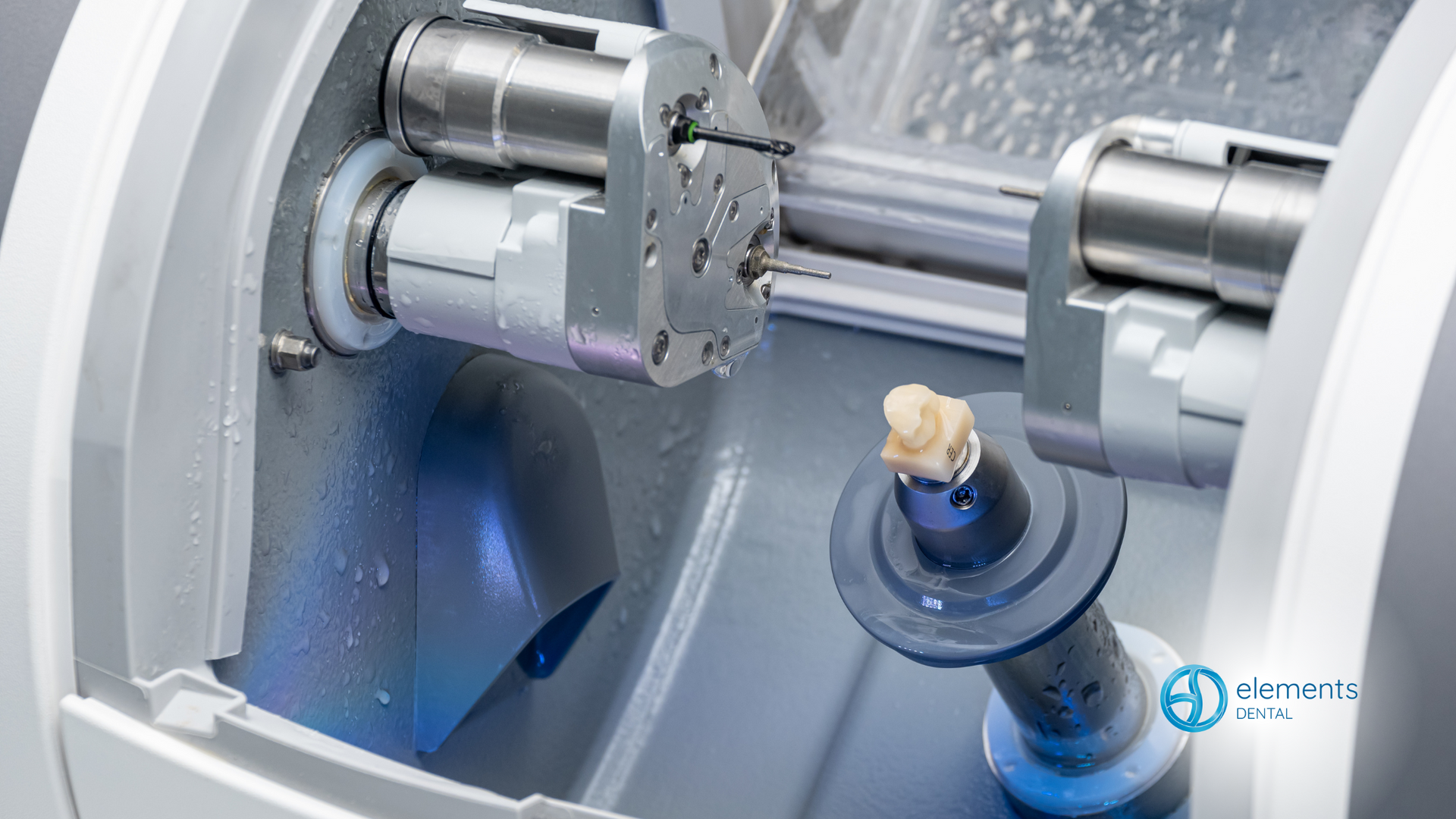 A machine is making a dental crown with a tooth in it.