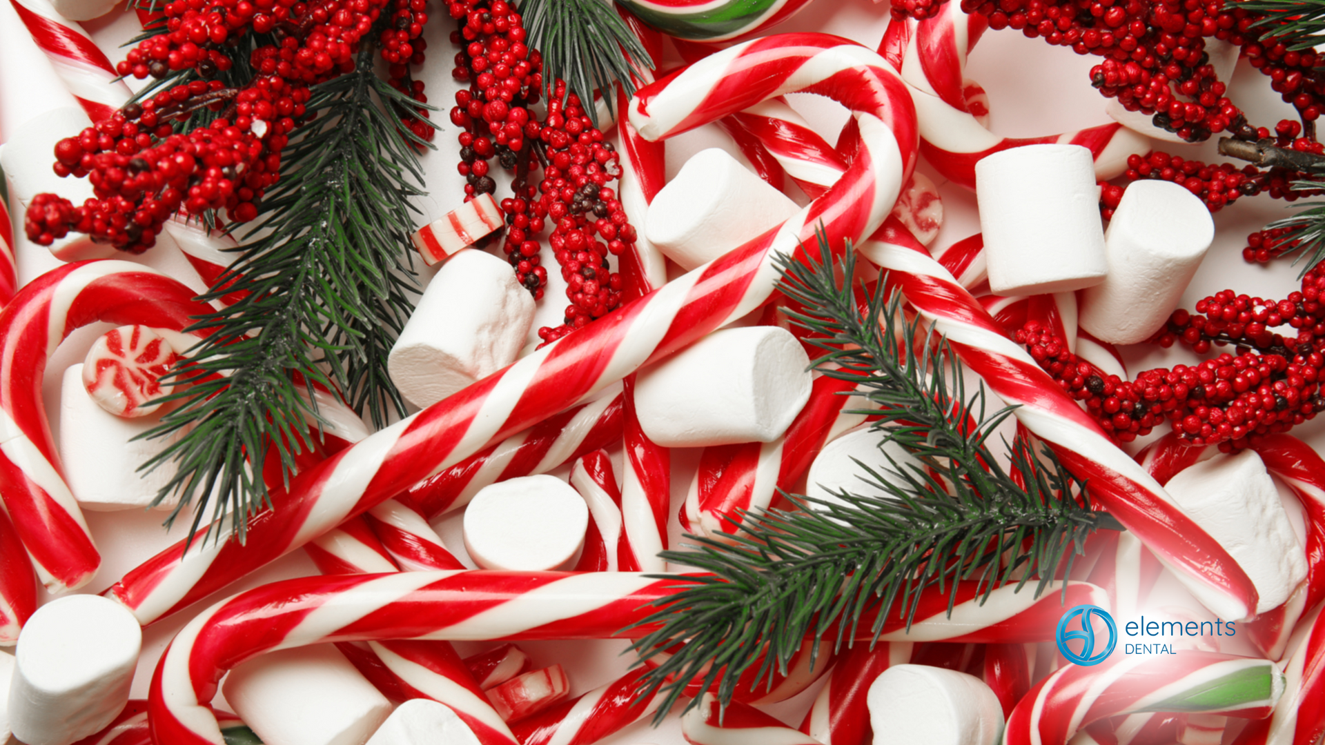 A pile of red and white candy canes and marshmallows.