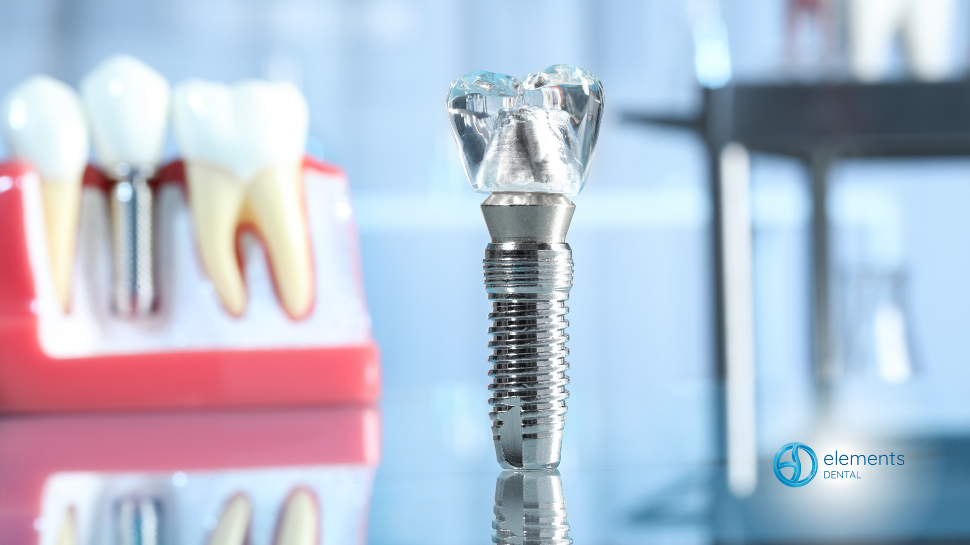 A dental implant is sitting in front of a model of teeth.