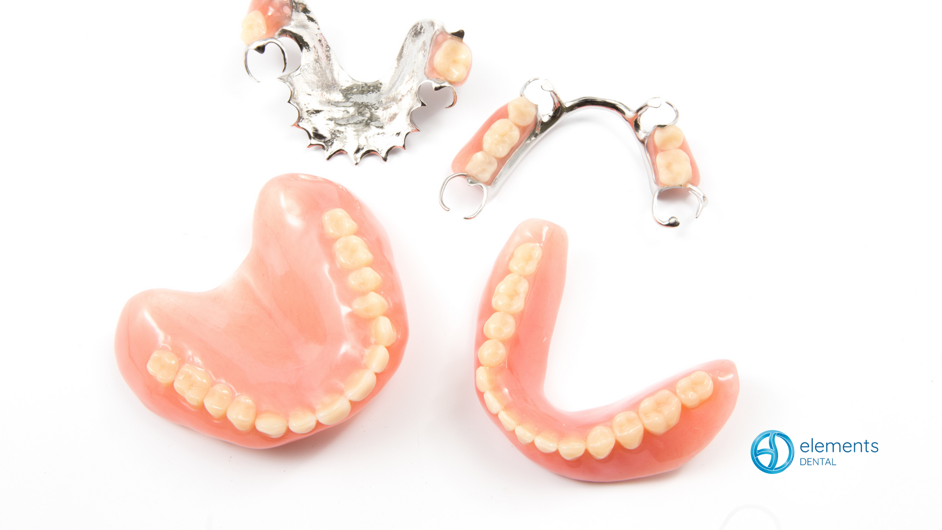 Three different types of dentures are sitting on a white surface.