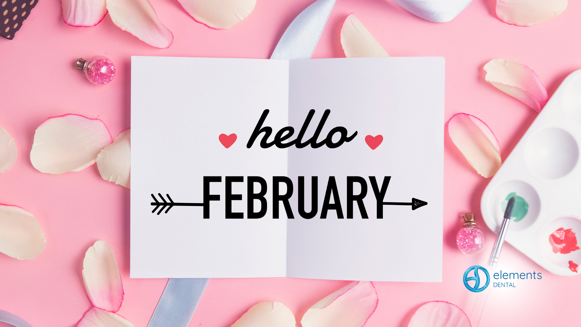 A card that says `` hello february '' is surrounded by pink petals.