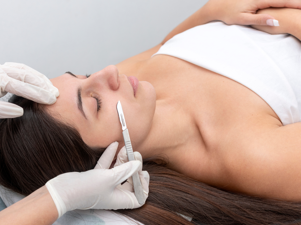 A woman is getting a botox injection in her face.