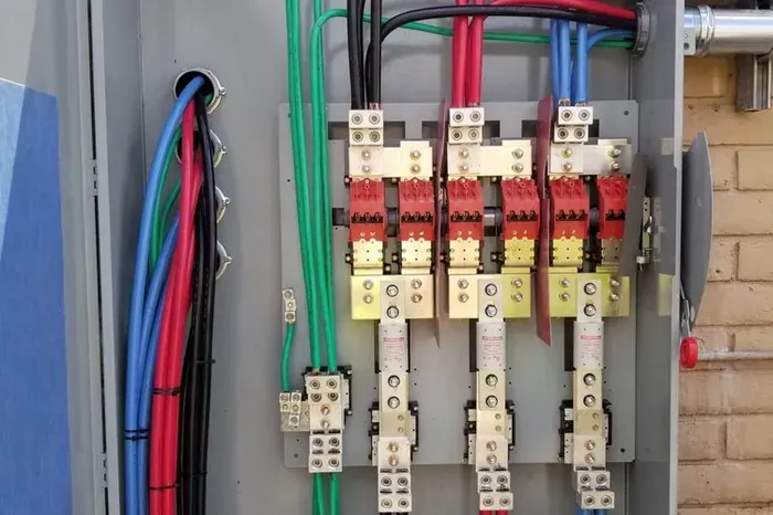 A electrical box with a bunch of wires coming out of it