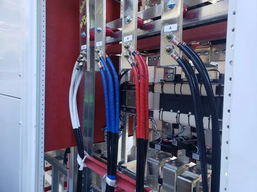 A bunch of wires are connected to a metal box