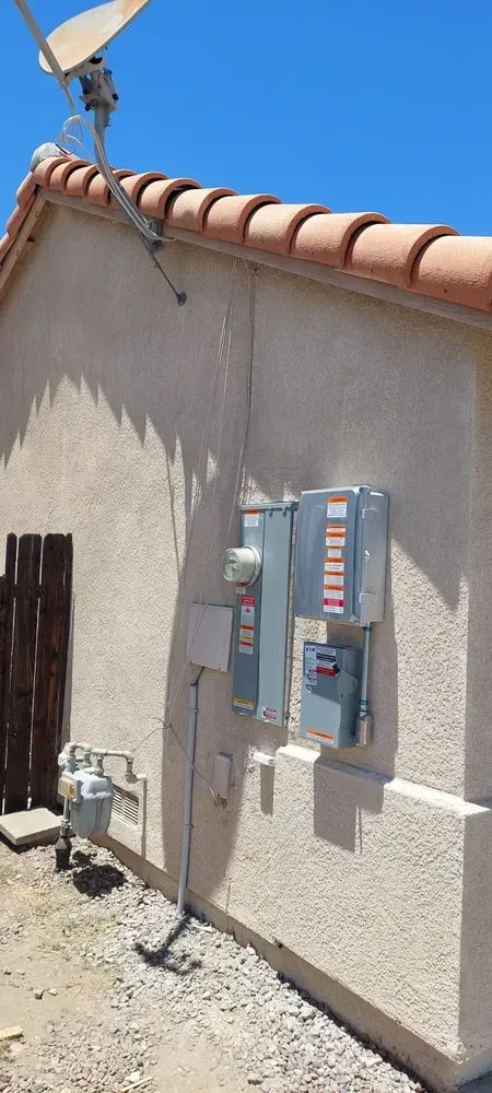 A house with a satellite dish on top of it.