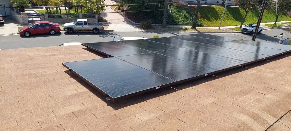 A roof with a lot of solar panels on it