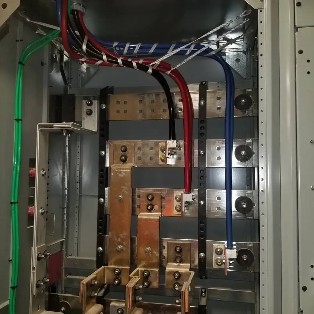 A electrical box with a bunch of wires coming out of it