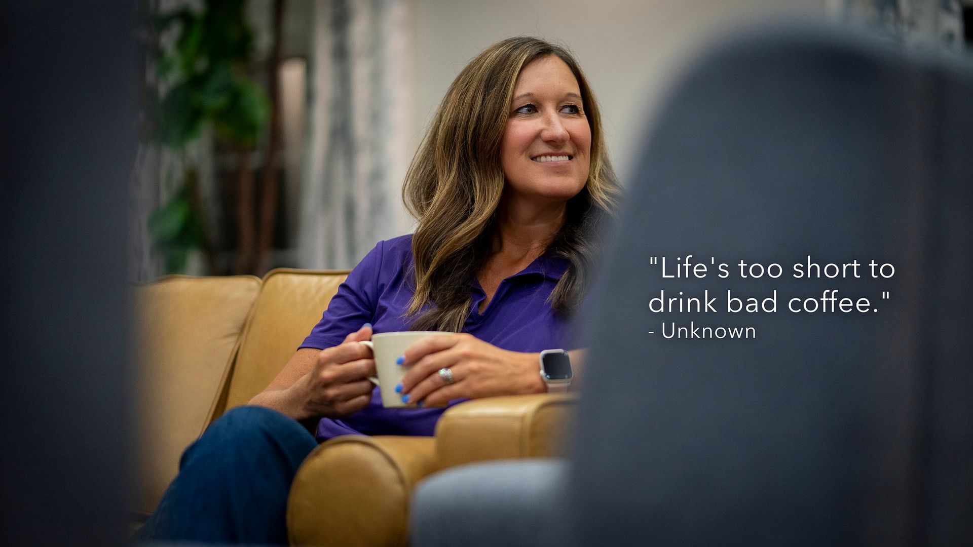 Woman in purple shirt smiles, holding a mug. Quotes: