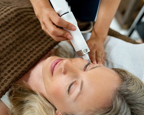 Woman Having Laser Treatment — Redlands, CA — Aesthetic Skin And Laser