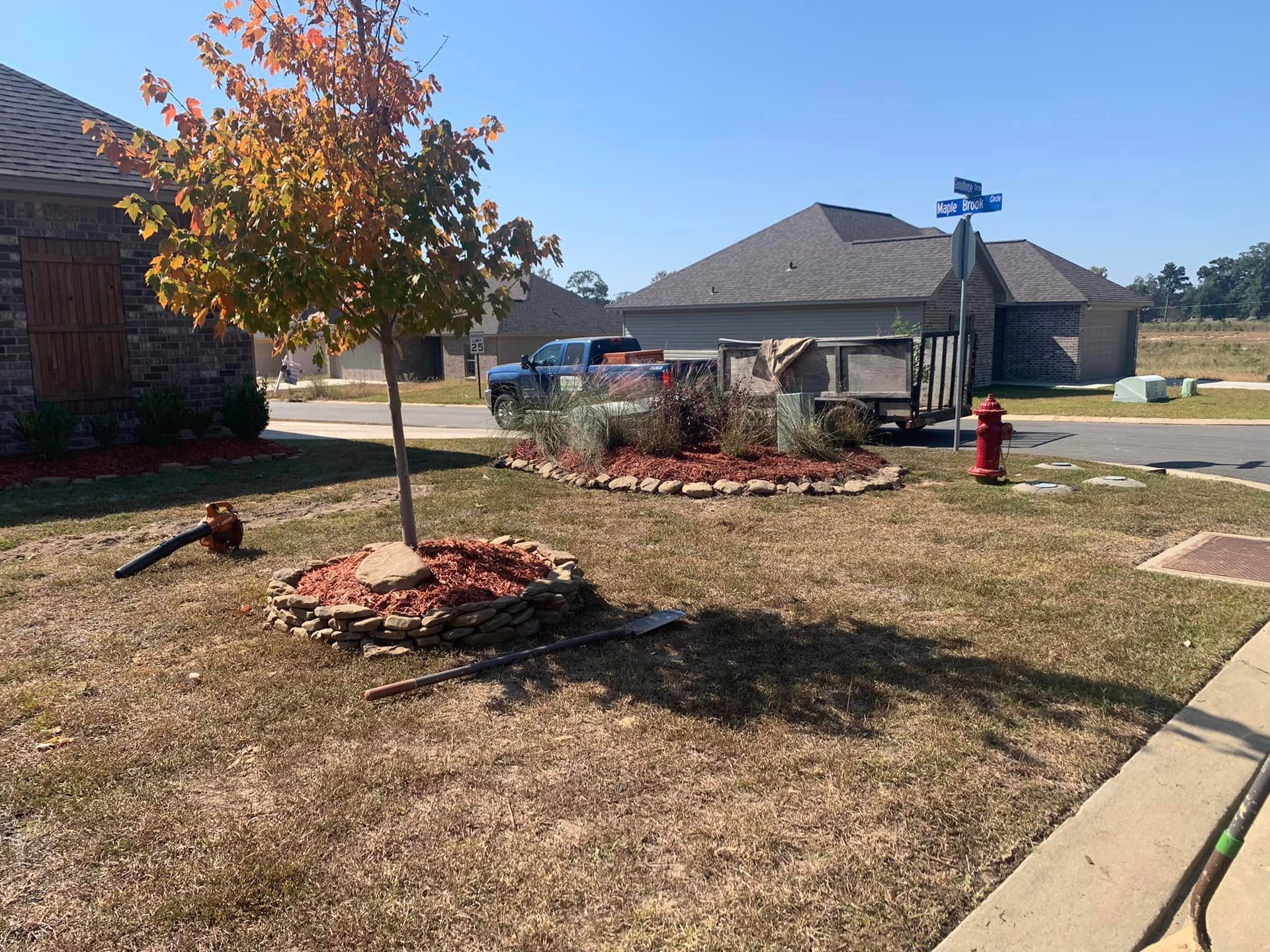 There is a fire hydrant in the middle of the yard.