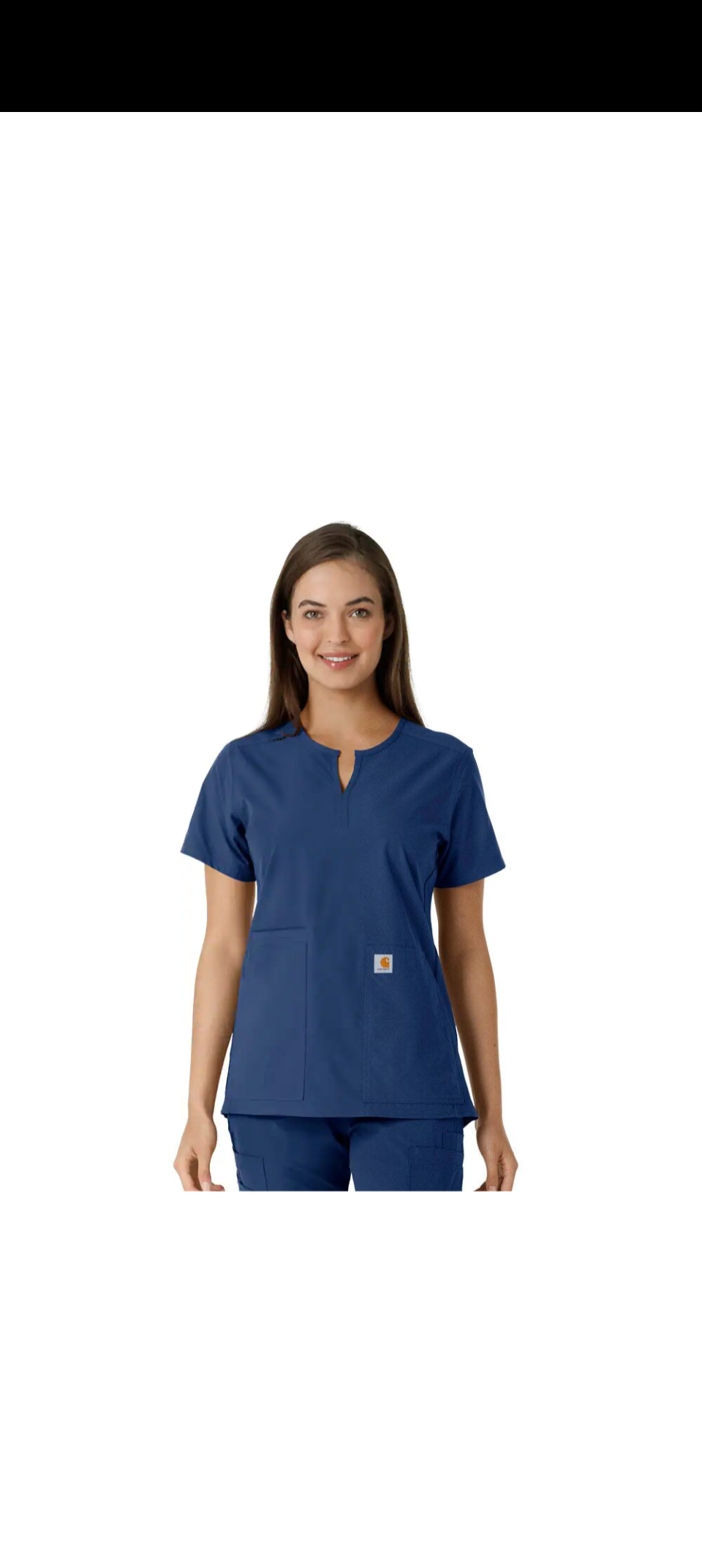 Woman wearing navy blue scrubs, smiling.