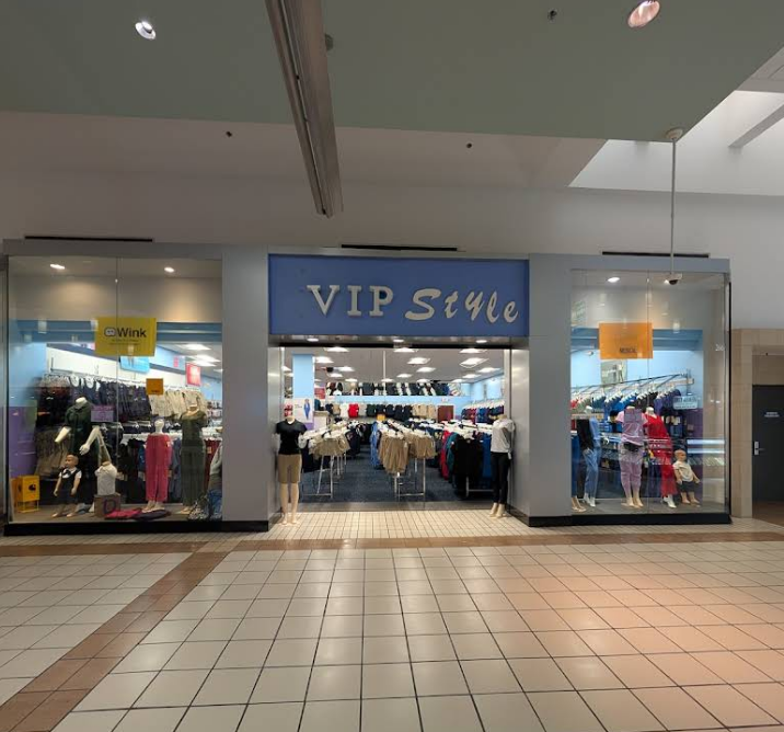 VIP Style clothing store at a mall, with glass storefront, display mannequins, and clothing racks.