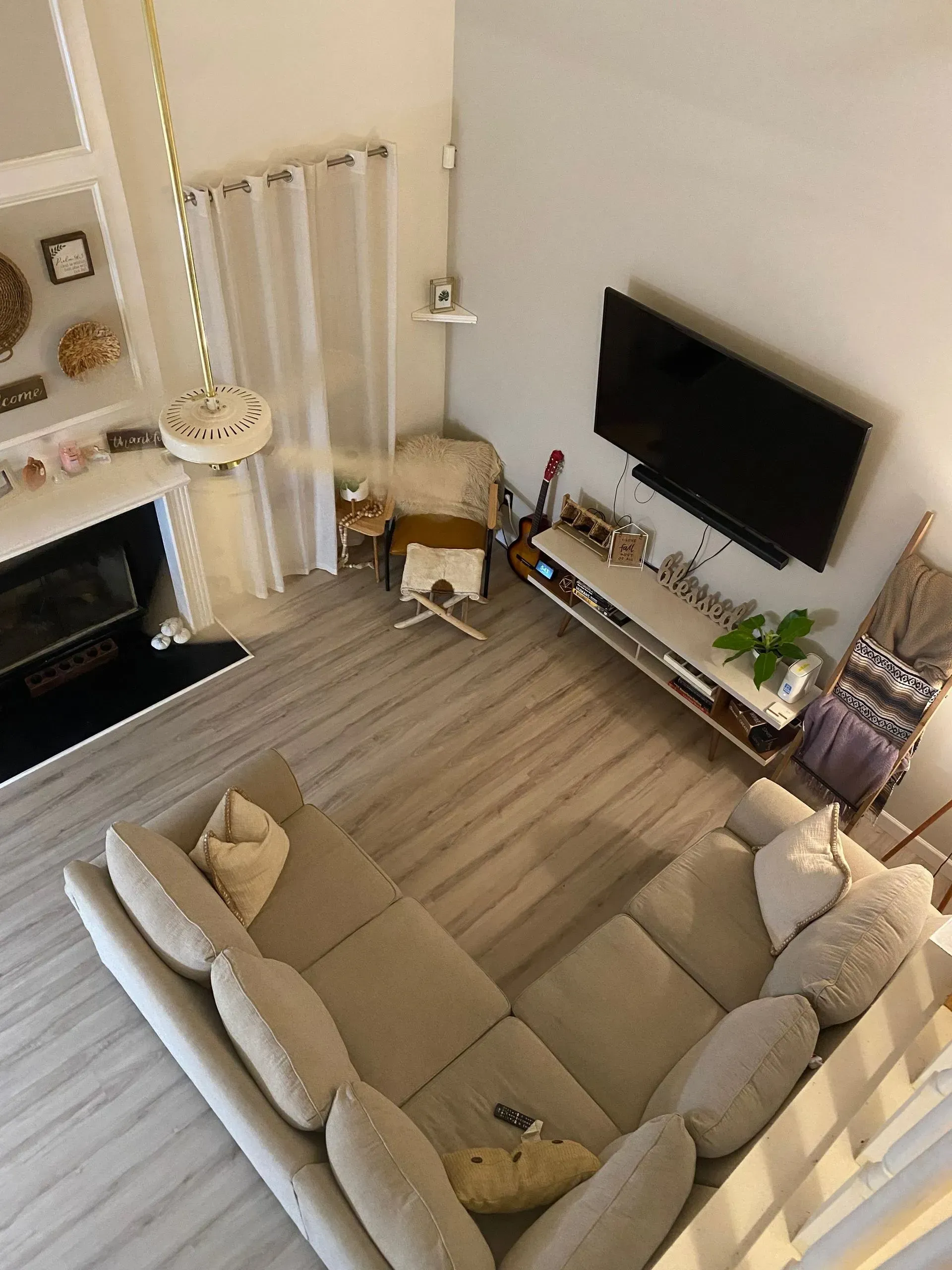 An aerial view of a living room with a couch and television