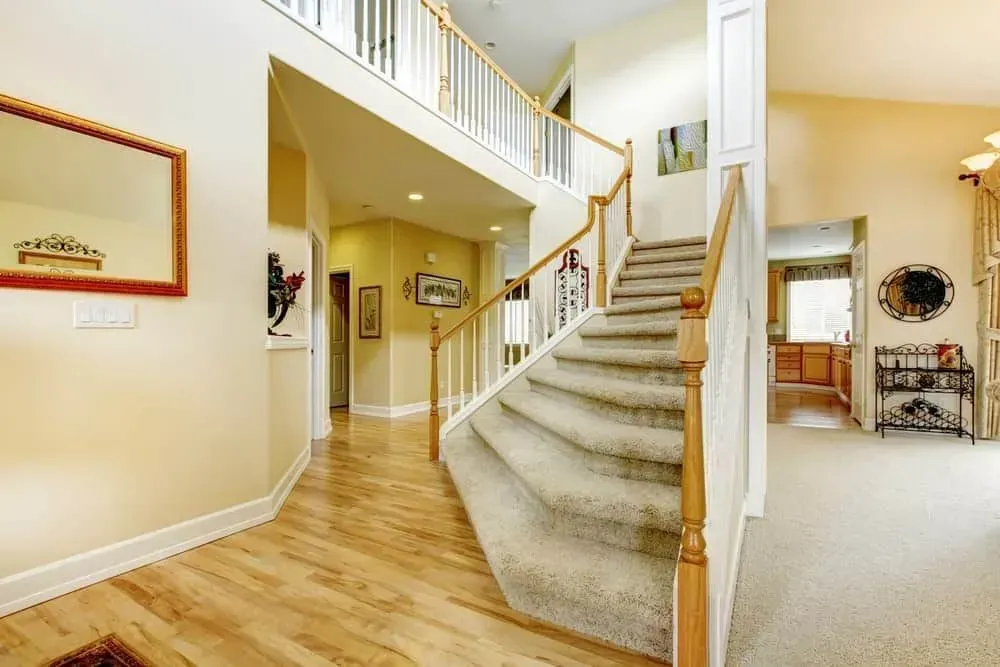There is a staircase leading up to the second floor of a house.