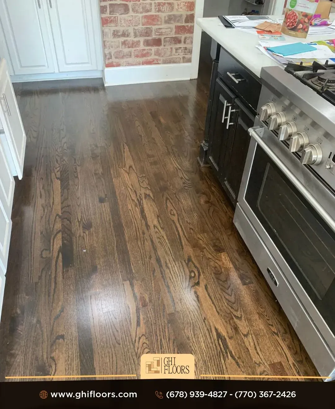 A kitchen with hardwood floors and a stove.