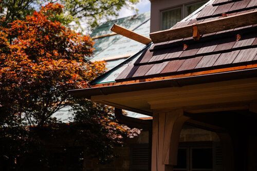 A house with a wooden roof is being remodeled.