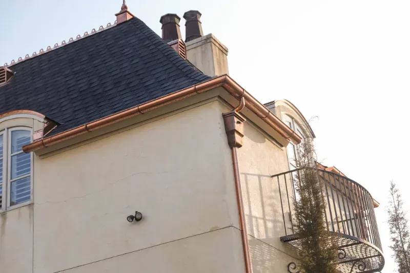 A house with a balcony on the side of it