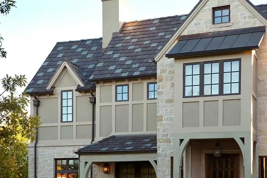 A large house with a slate roof and many windows