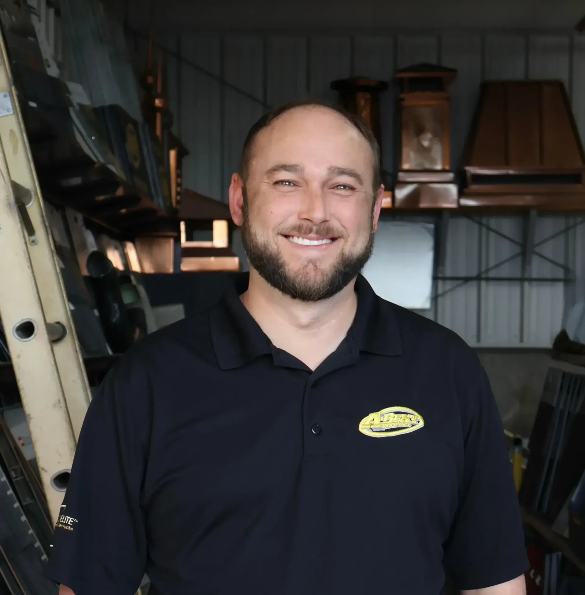 A man wearing a black shirt with the word allen on it
