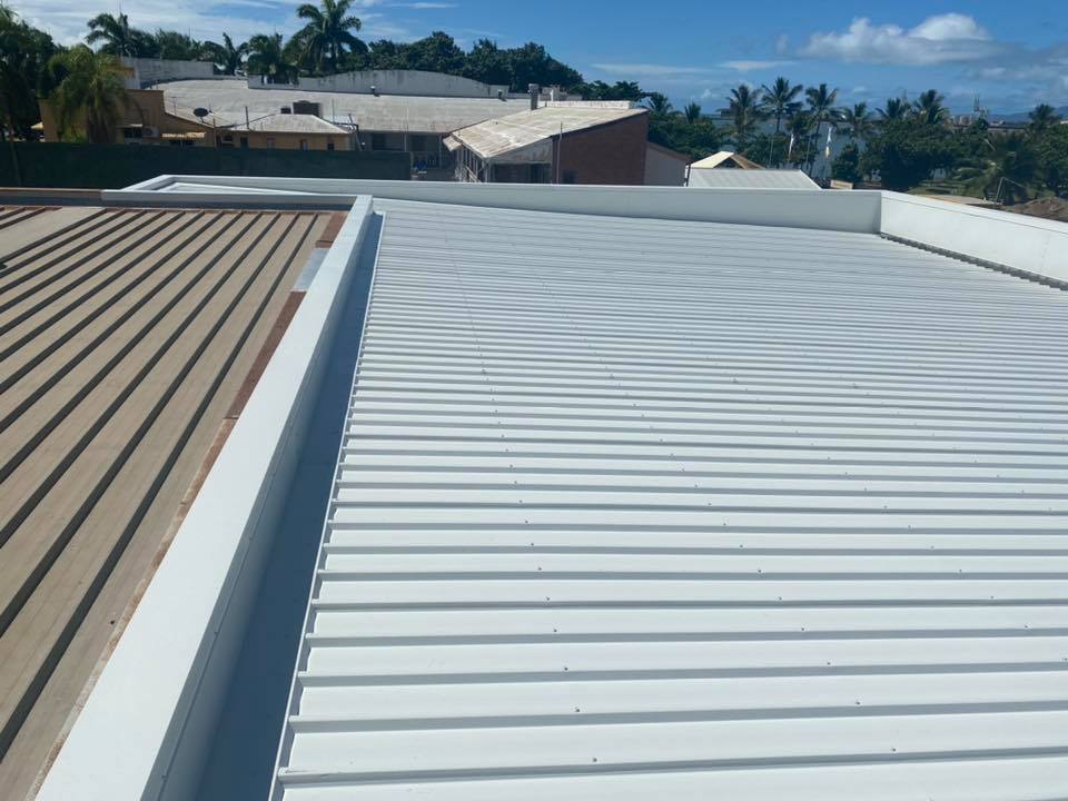 Building Roof Made With Metal Sheet Roof — Tile-to-Tin Reroofing in Townsville, QLD