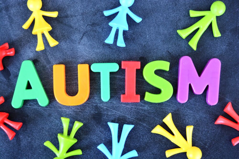 The word autism is spelled out in colorful letters