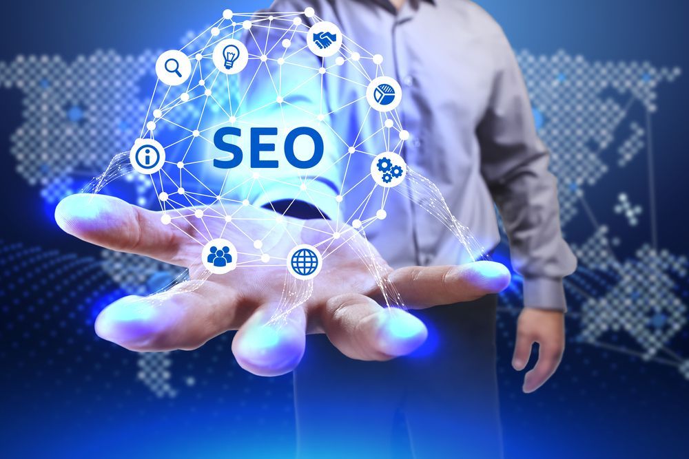 A person holds a glowing, digital sphere featuring the text 