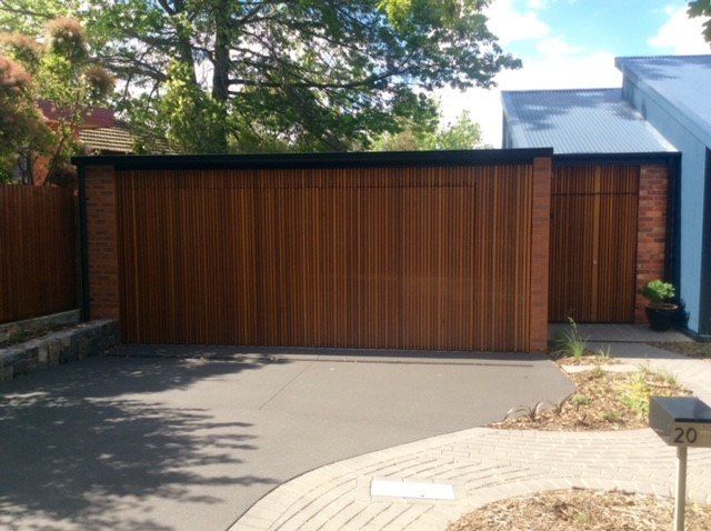 Custom Timber Flush Mounted Tilt Door Front View — Canberra, ACT — Capital Doorworks