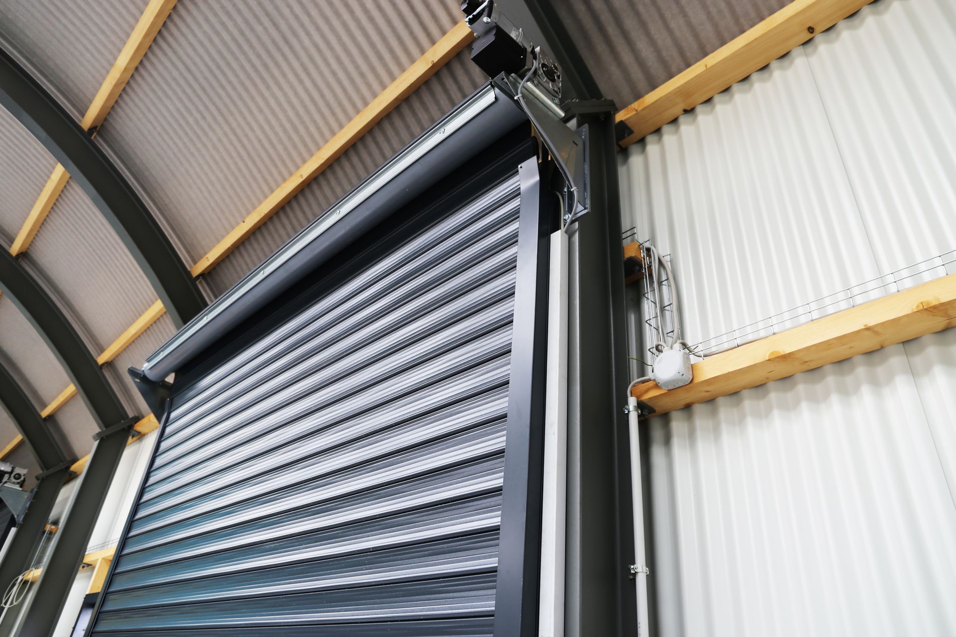 Industrial sectional door showcasing quality work by local garage door services.