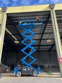 Construction worker inspecting roller shutter service installation