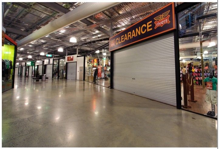 Indoor shopfront roller shutters in Canberra, ACT at a retail clearance store.