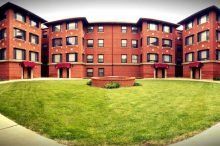 Red building with courtyard area outside