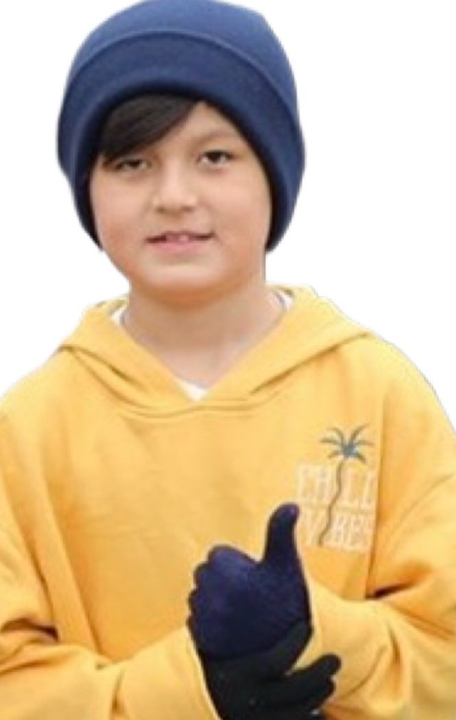 Boy in a blue beanie and yellow hoodie gives a thumbs-up, wearing blue gloves.