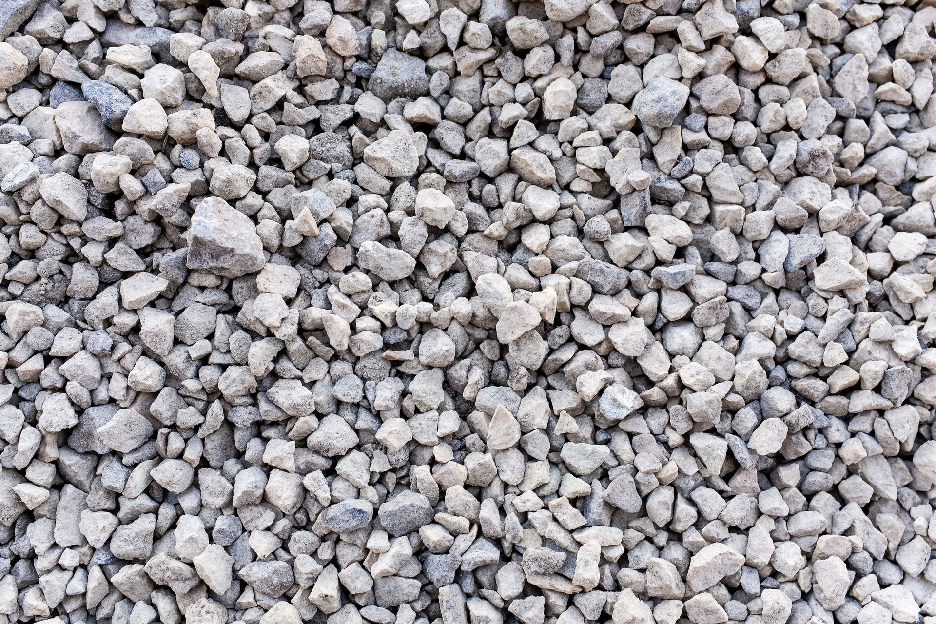 A pile of gravel is sitting on the ground.