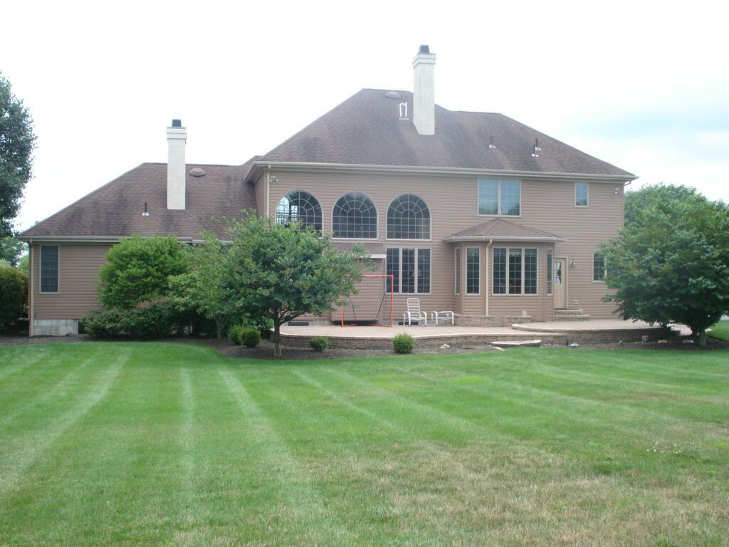 Big Home With A Sizable Yard In Front Of It — Columbus, NJ — G & G Landscaping Construction, Inc.