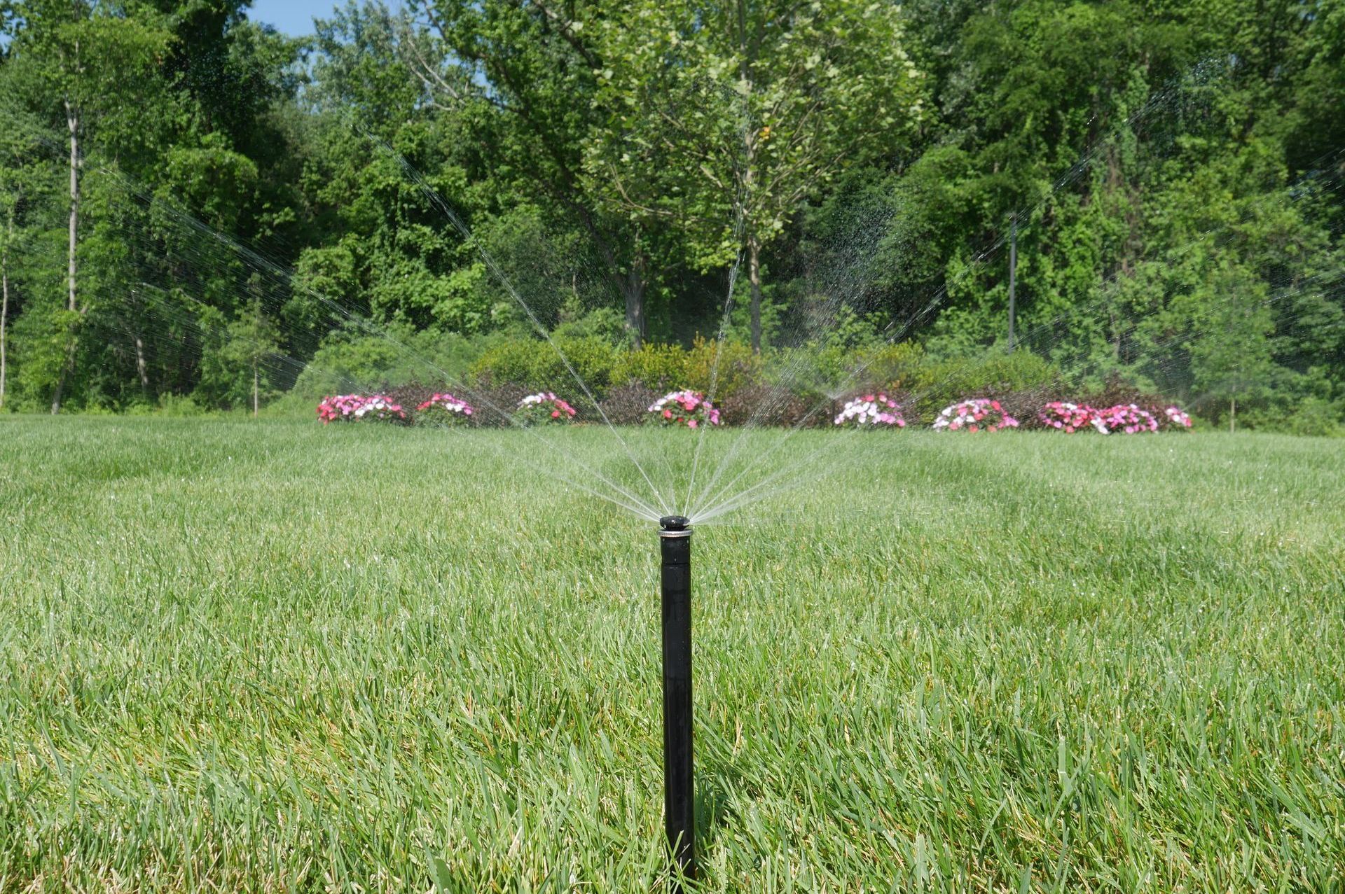 A Close Up Of A Sprinkler In A Garden — Columbus, NJ — G & G Landscaping Construction, Inc.