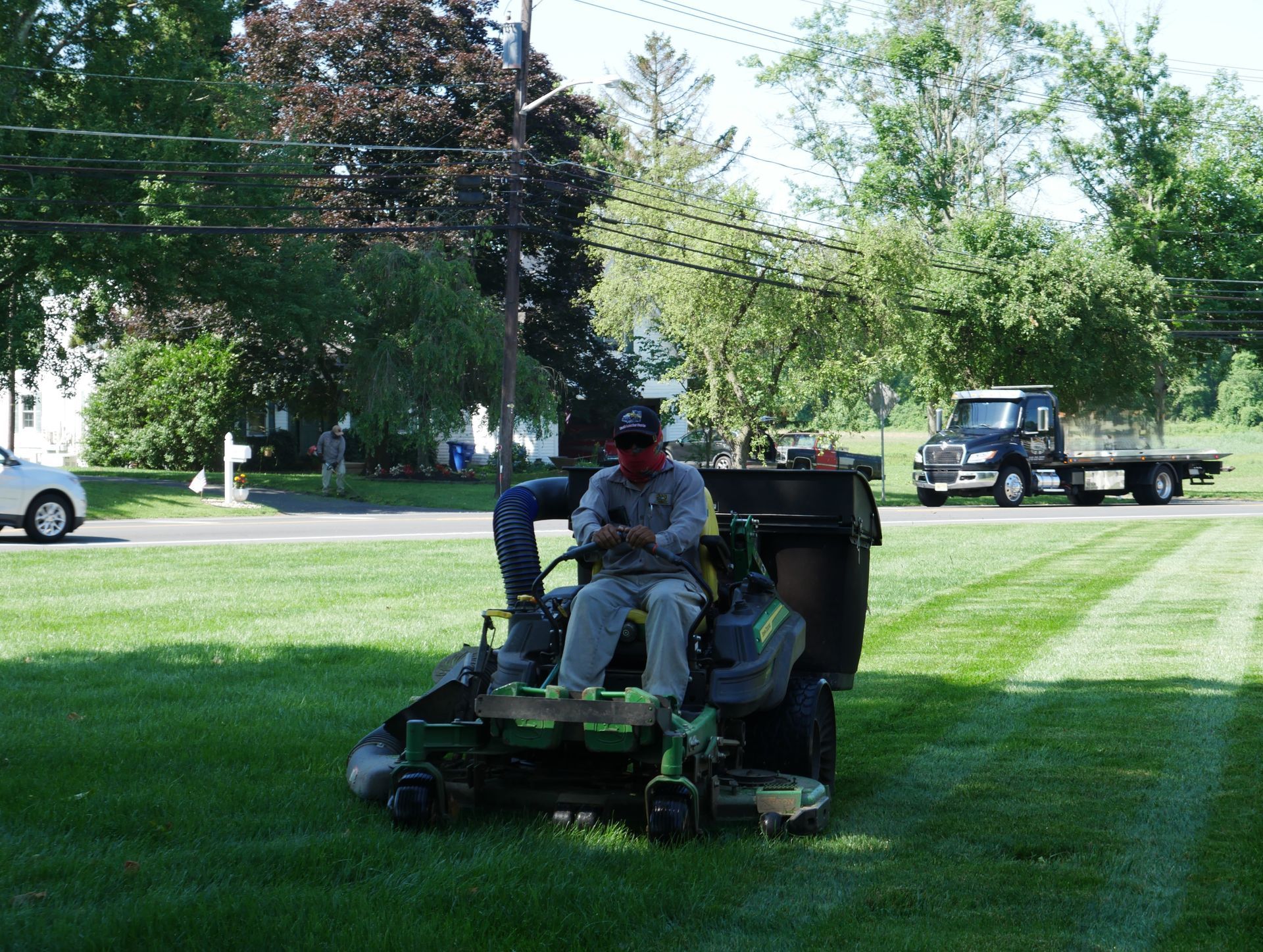 Lawn Mower Cutting Grasses — Columbus, NJ — G & G Landscaping Construction, Inc.